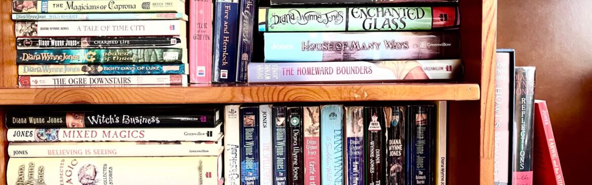 Emily's photo of her bookcase shows her copies of all the Diana Wynne Jones books to be read in the readthrough. Many are tattered.